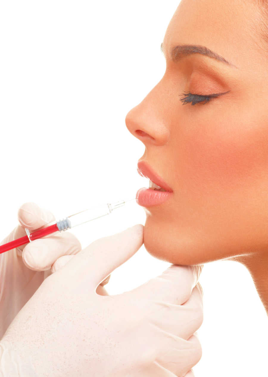 Shows Patient Being Injected With Lip Filler